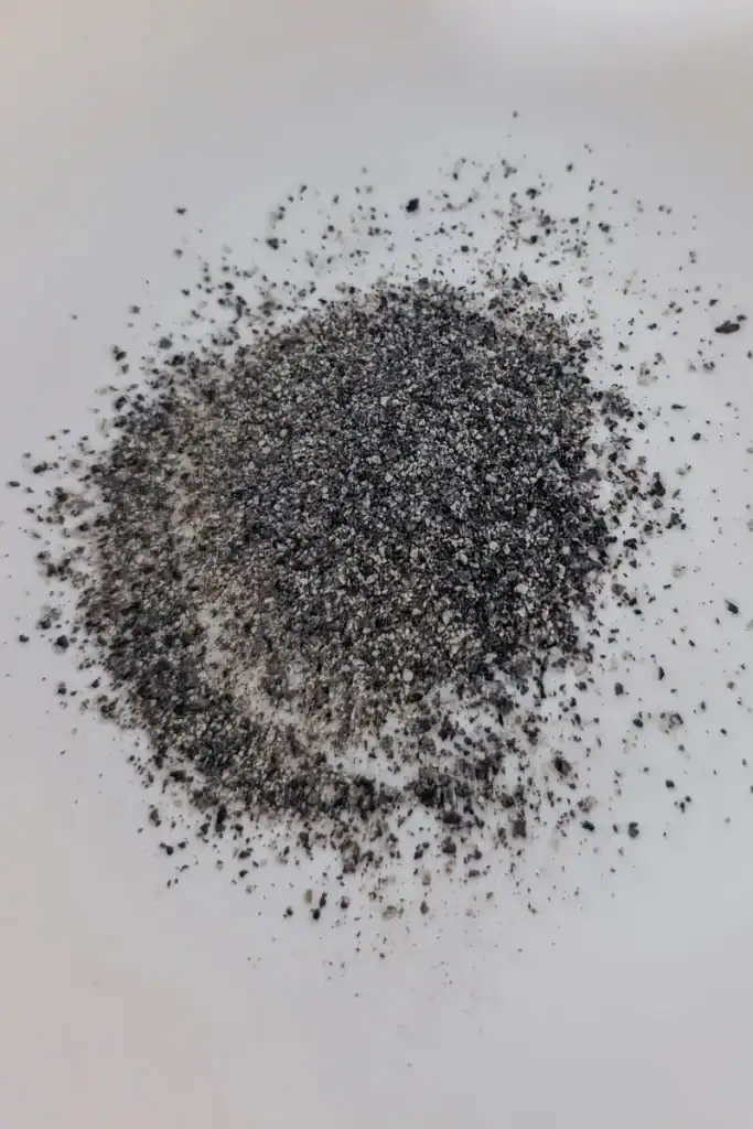 adding black pepper to spice rub