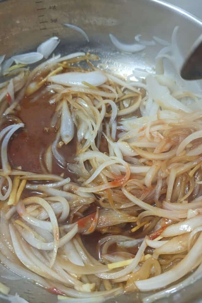adding other sauce ingredients to sauted onions