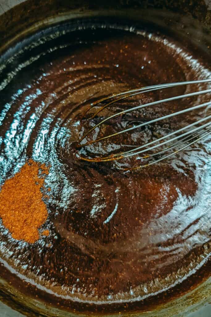 adding anciote pepper to sauce