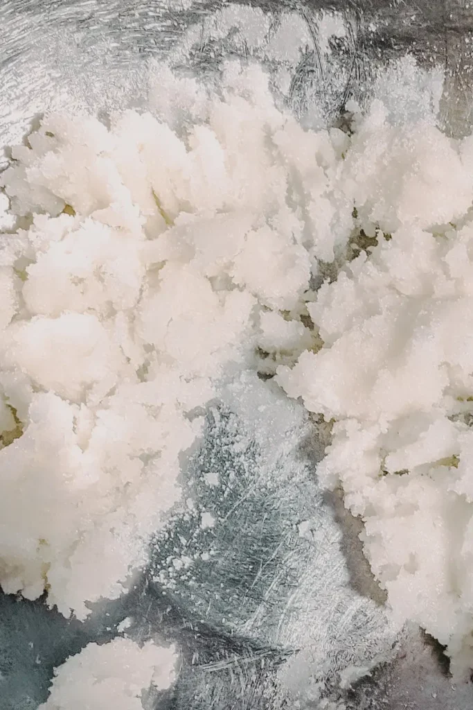 blending white sugar into cream cheese