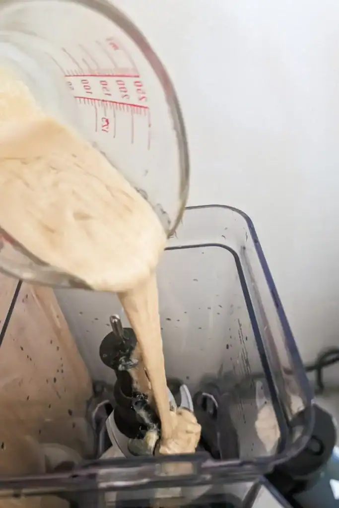 adding tahini to blender