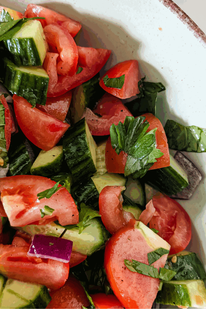 close up corner of the cucumber tomato salad