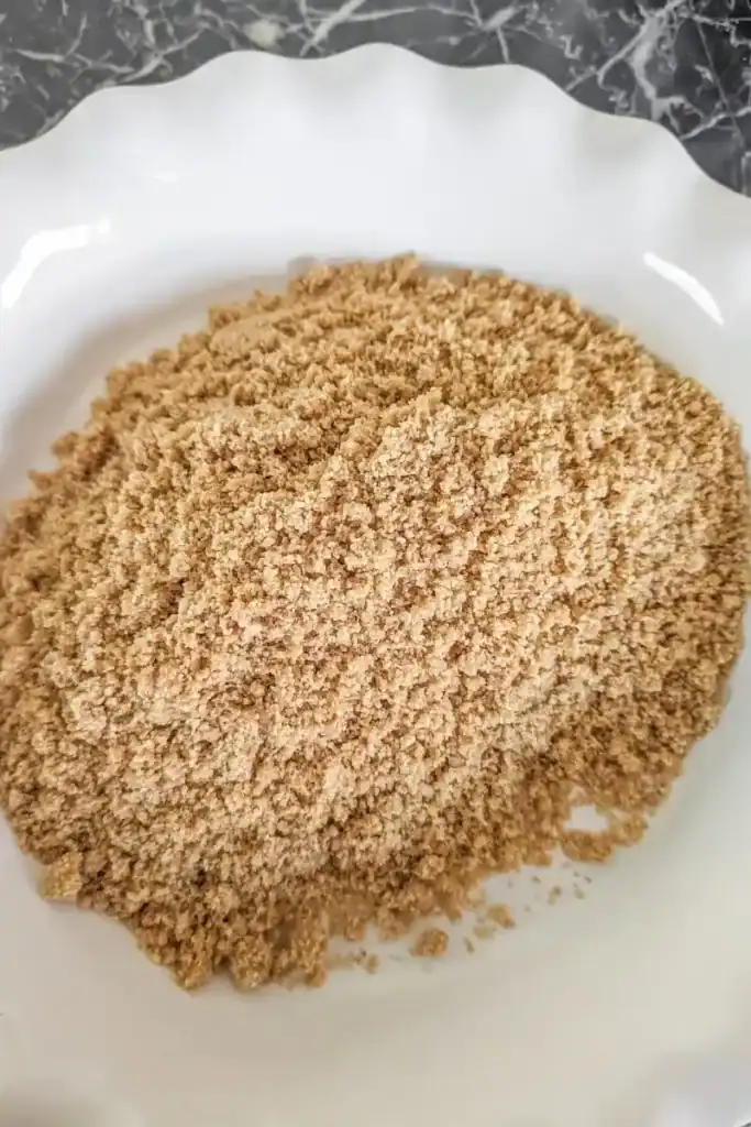 graham cracker crust dumped in pie pan