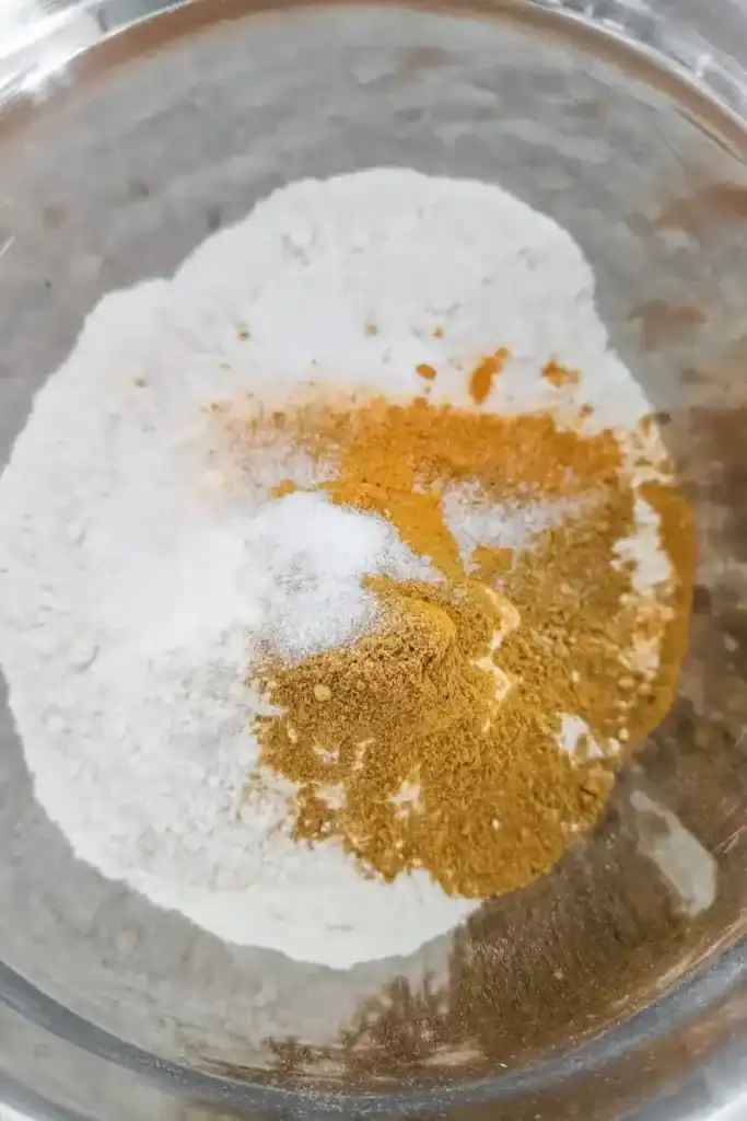 adding salt and sugar to patty dough