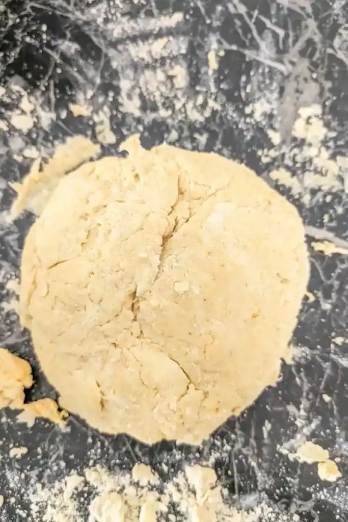 formed Jamaican patty dough on lightly floured work surface