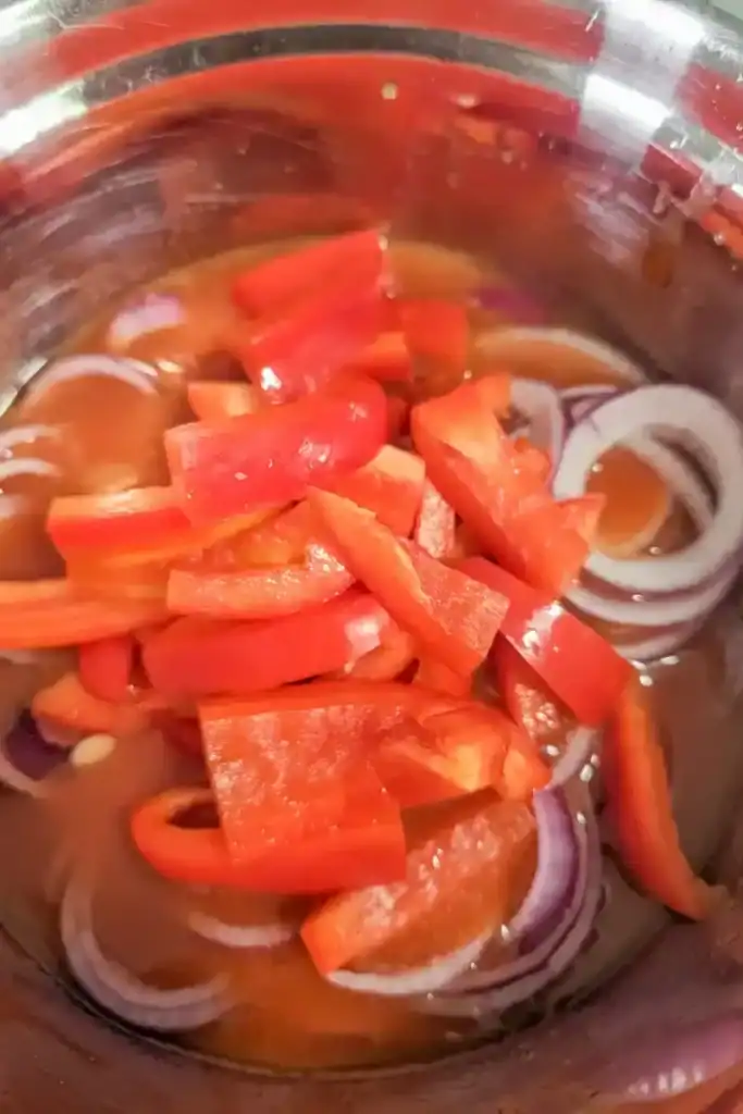 add chopped red pepper to the salad marinade and red onions