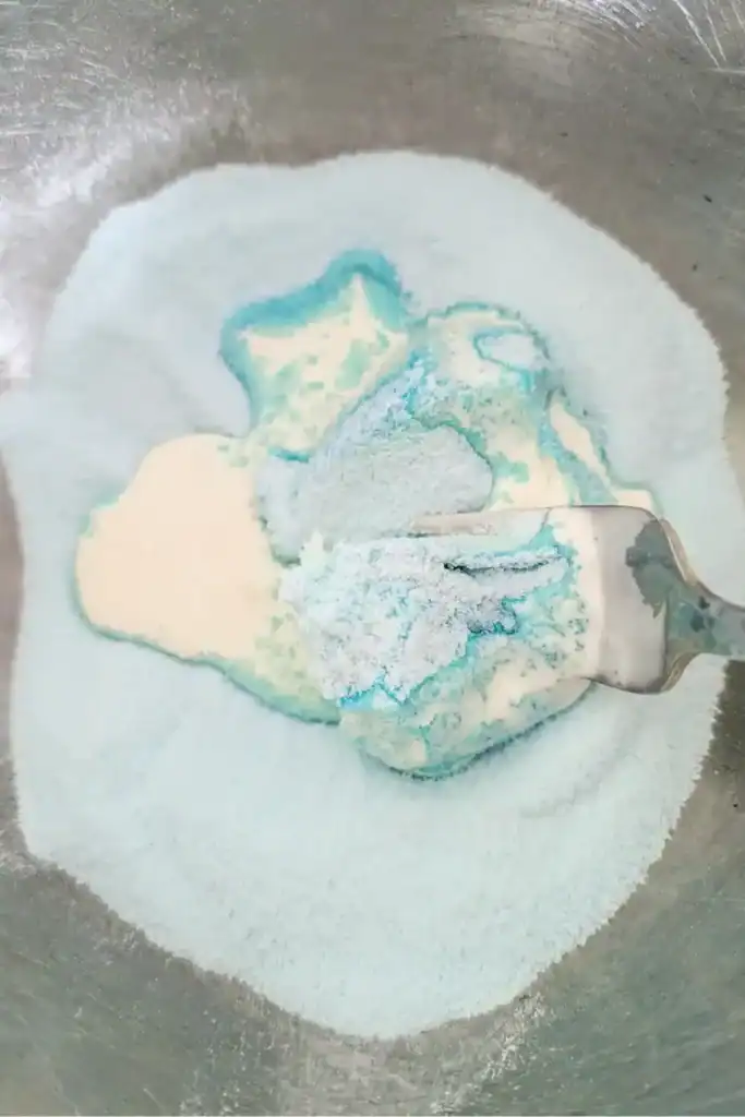 koolaid powder blending with cream cheese and cream