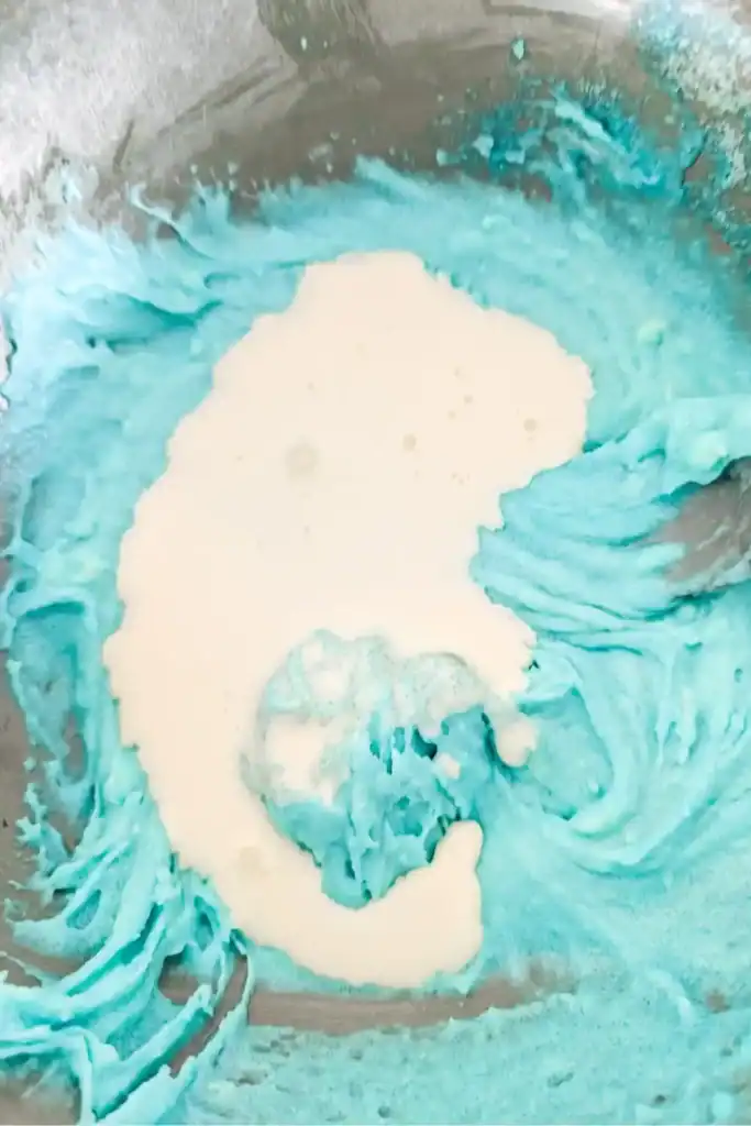 mixing koolaid powder cream cheese and cream