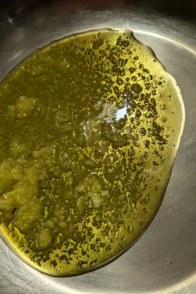 ghee melting in stainless steel pan