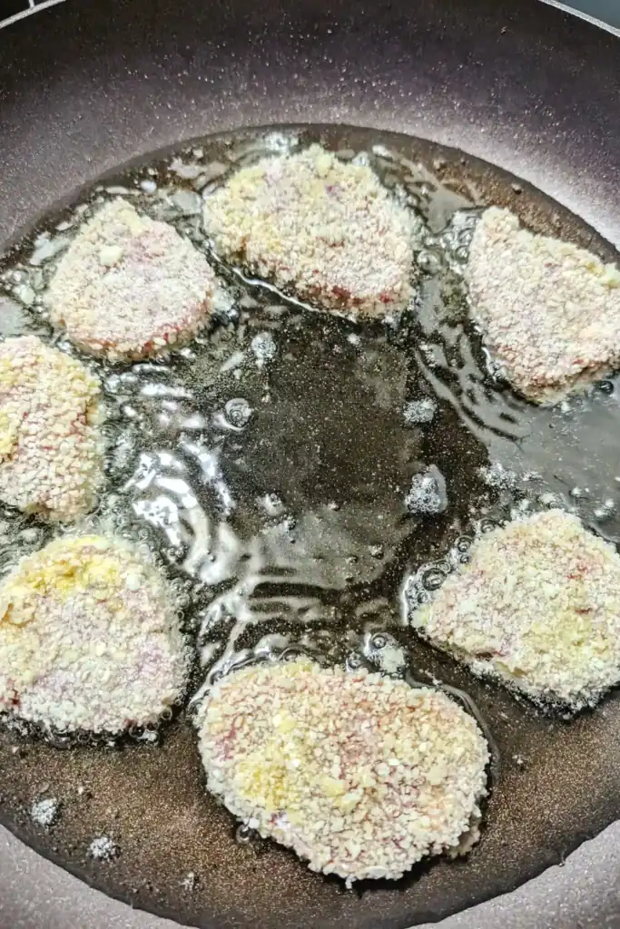 cooking the medallions in oil in frying pan