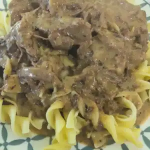 Rich Beefy Noodles on a blue and white plate