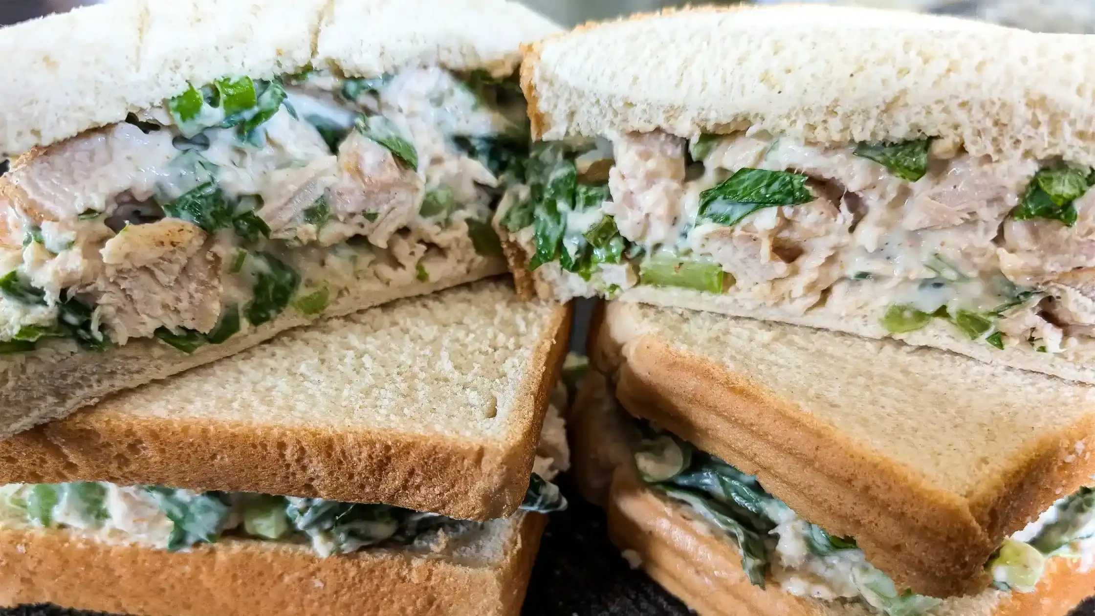 featured image chicken salad sandwiches stacked upon each other top one cut open facing viewer