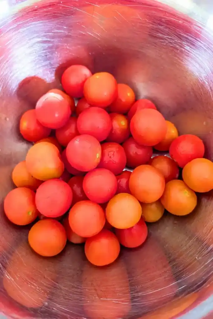 cherry tomatoes in stainless steel bowl