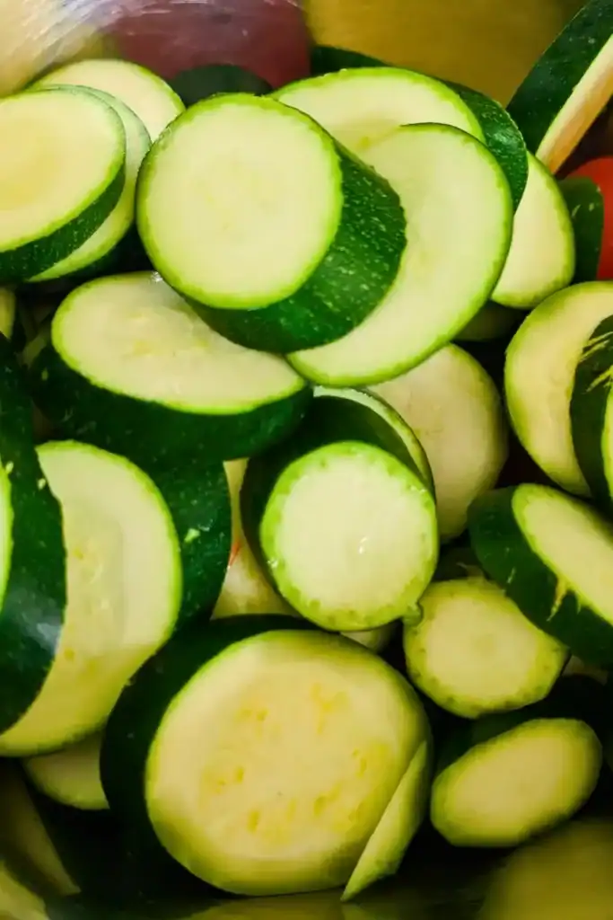 sliced green zucchini and cherry tomatoes in bowl