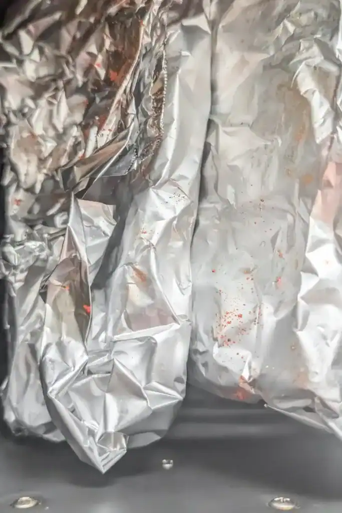 sealing the foil rib packets and adding to the air fryer basket
