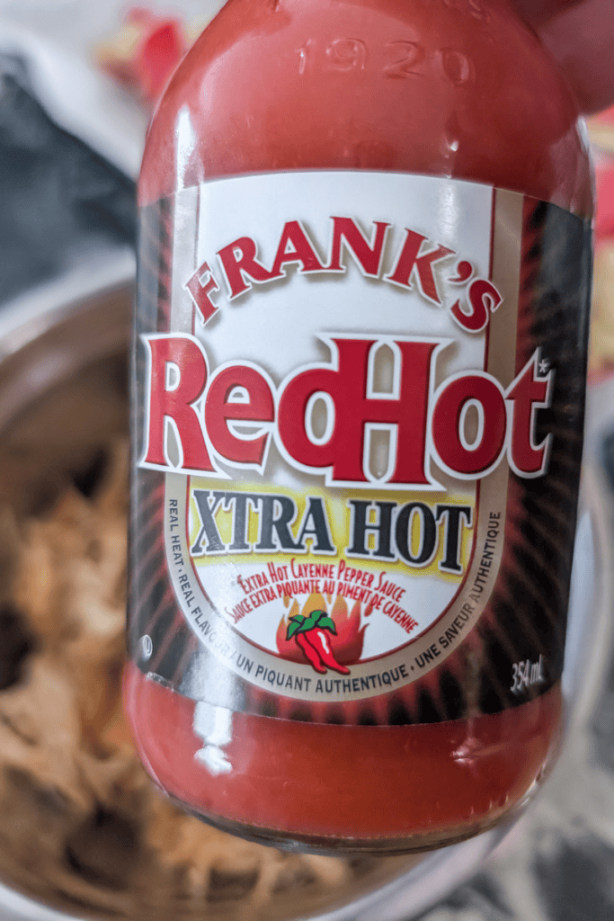 Frank's RedHot XTRA HOT sauce for spicy buffalo chicken nachos.