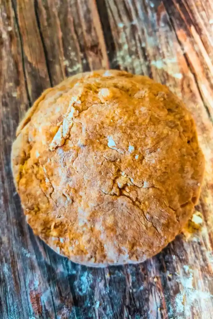 forming a ball with the pumpkin scone dough after lightly working