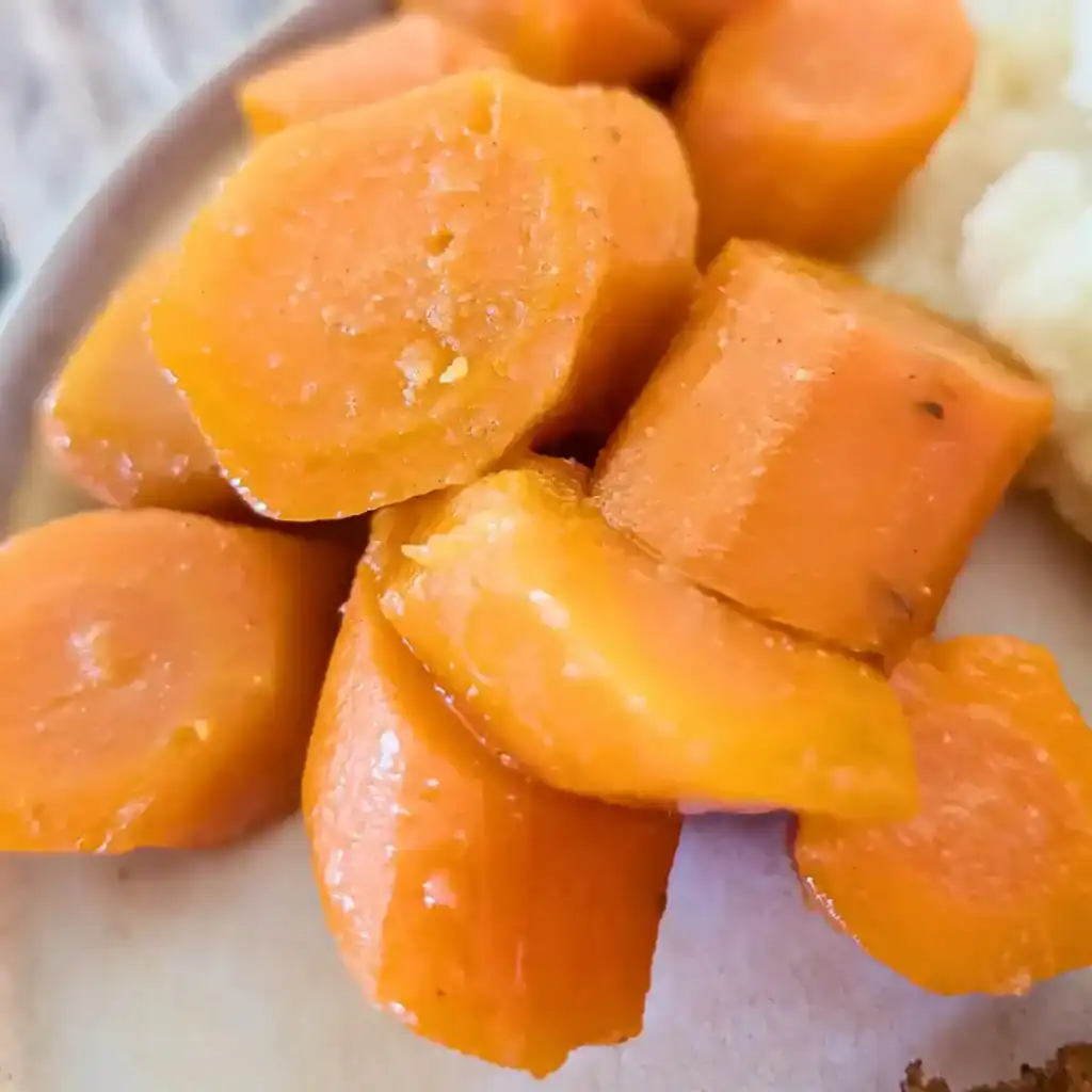 close up of honey ginger glazed carrots recipe card image