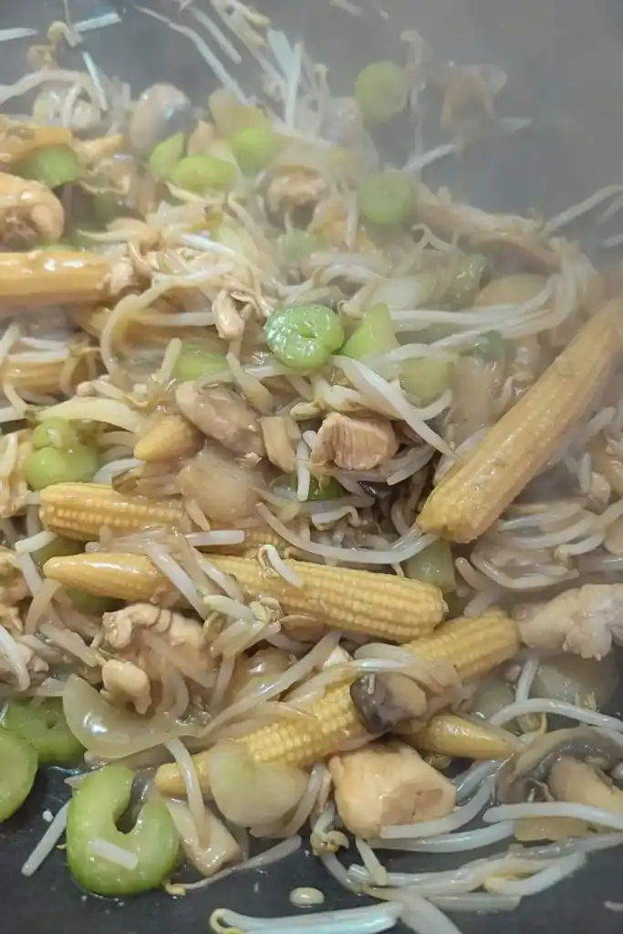 the thickened chop suey sauce coating the ingredients in the wok