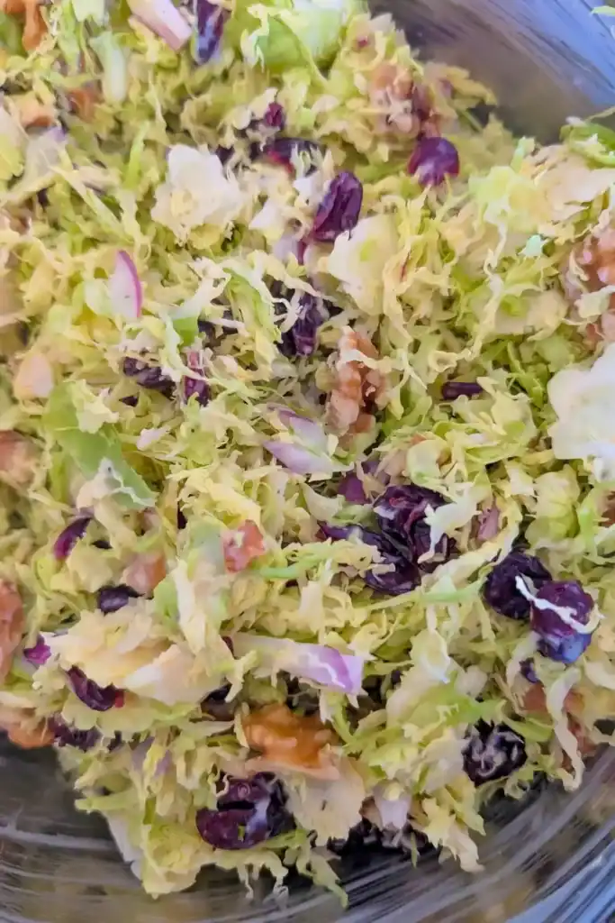 tossed raw shaved brussels sprouts salad