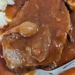 from above dutch oven Hungarian pot roast with tomato-rich gravy