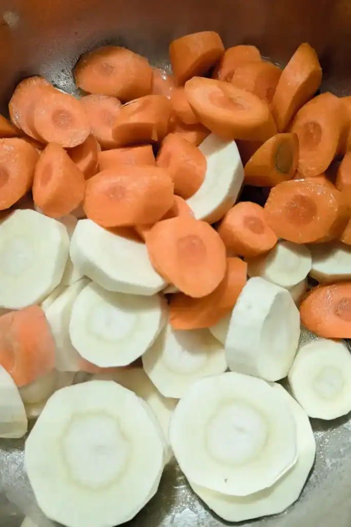 raw sliced carrots and parsnips