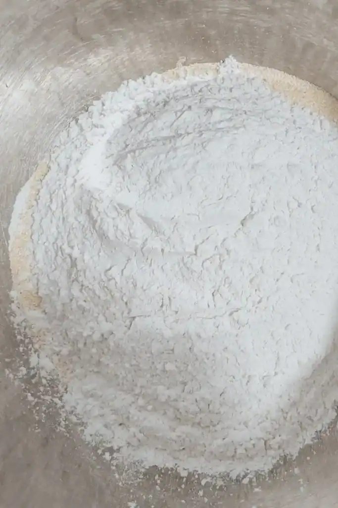 adding flour to cornmeal