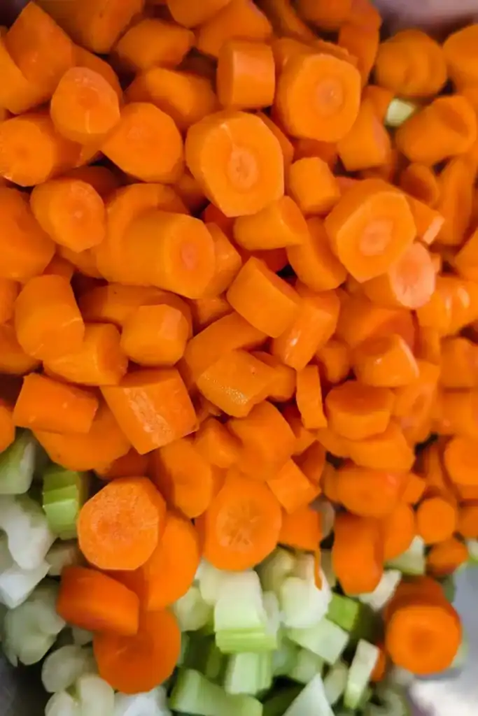 adding carrots to bowl