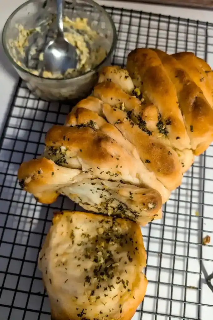 further away baked garlic bread on wire rack