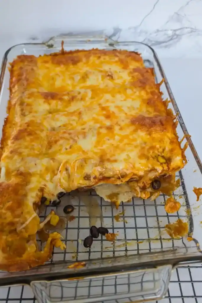 pan of ground chicken enchiladas two removed