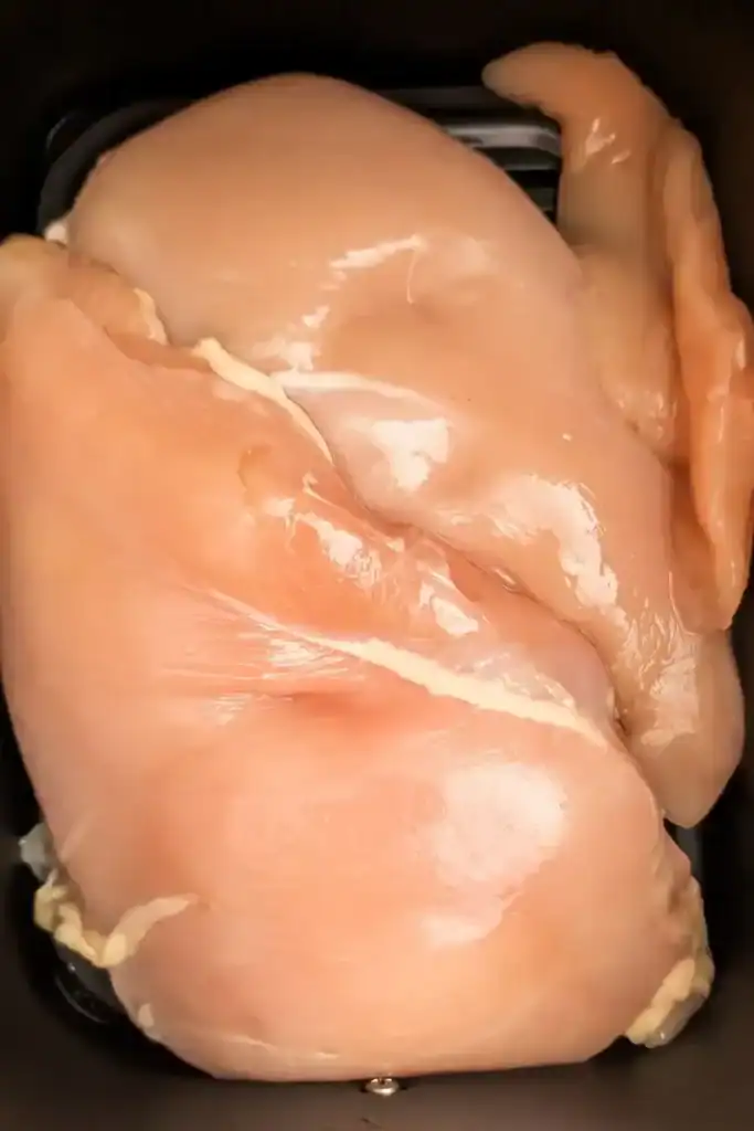 single layer of chickenbreast in air fryer basket
