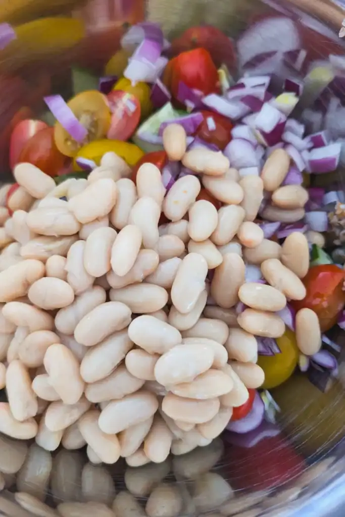 adding drained white beans