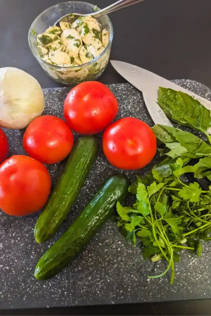 gathering tomato cucumber herbs