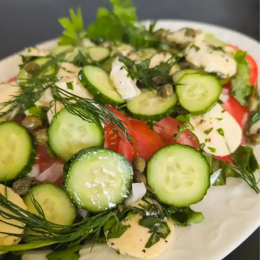summer tomato cucumber salad with cheese and herbs