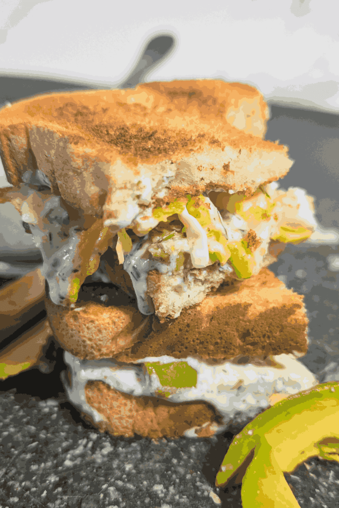 green goddess egg sandwich cut in half and stacked