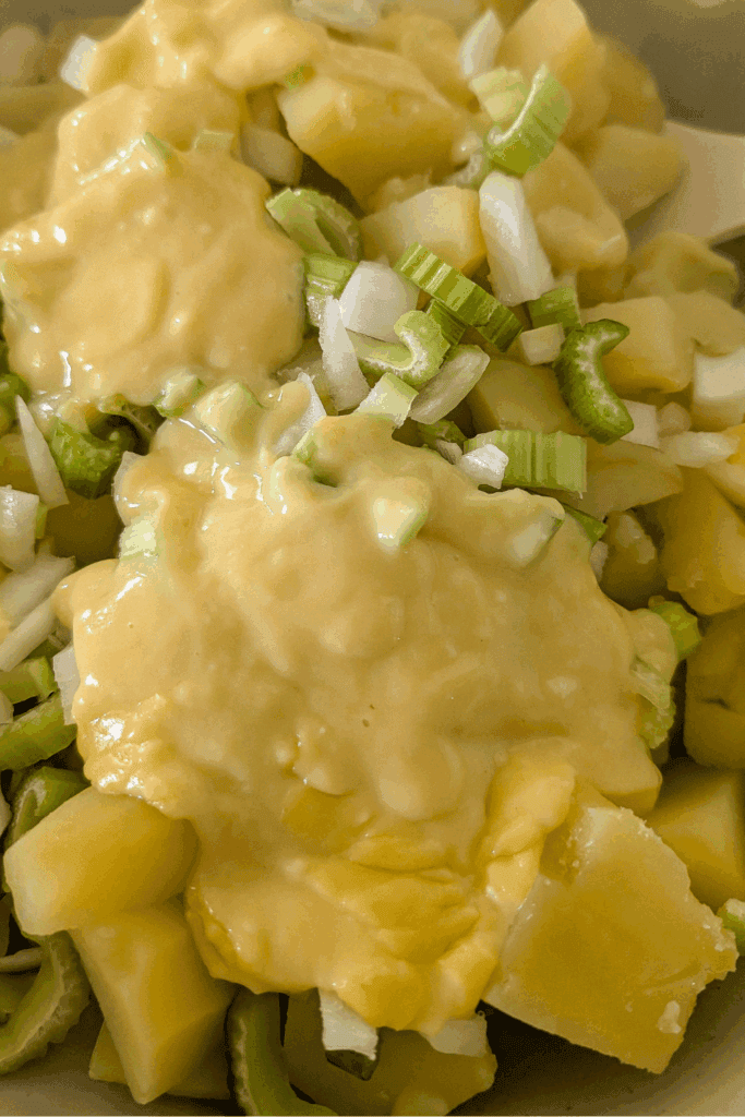 adding salad dressing to salad