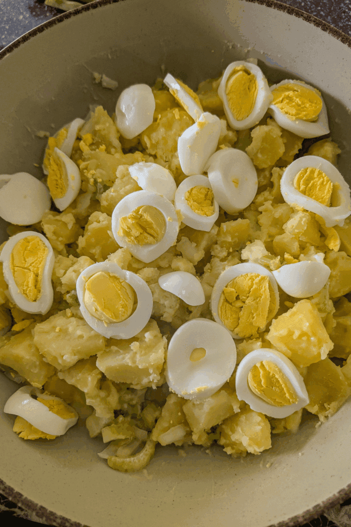 adding the chopped egg to salad