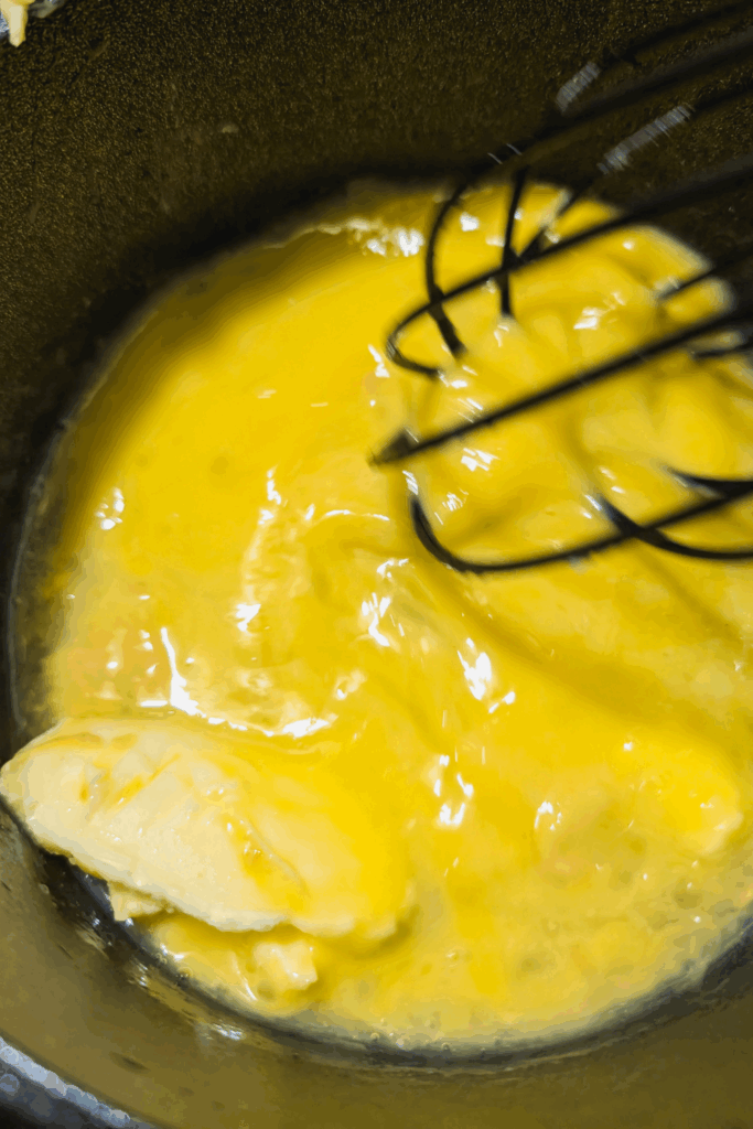 adding vinegar and whisking to melt butter