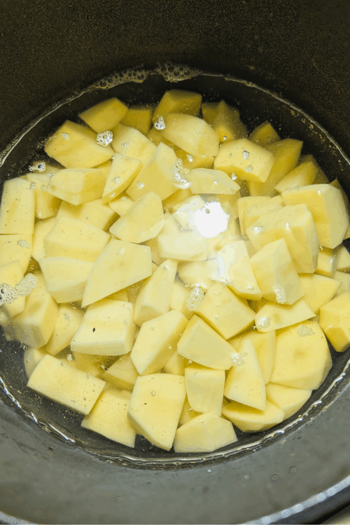 adding water to diced potatoes