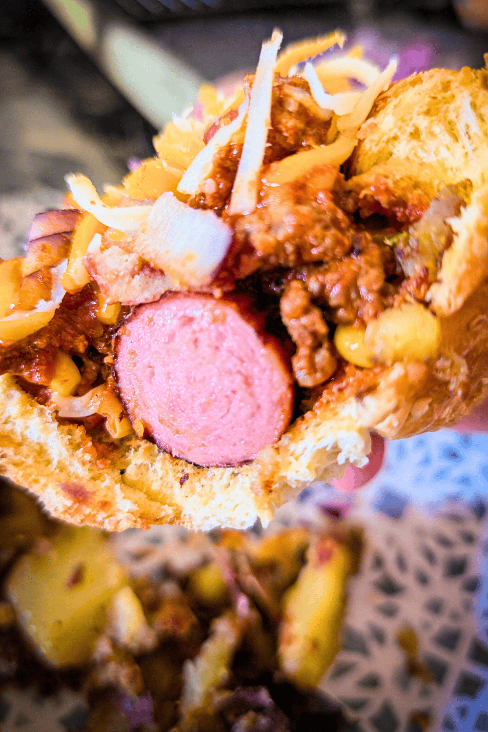 cut in half ready to eat chili dog