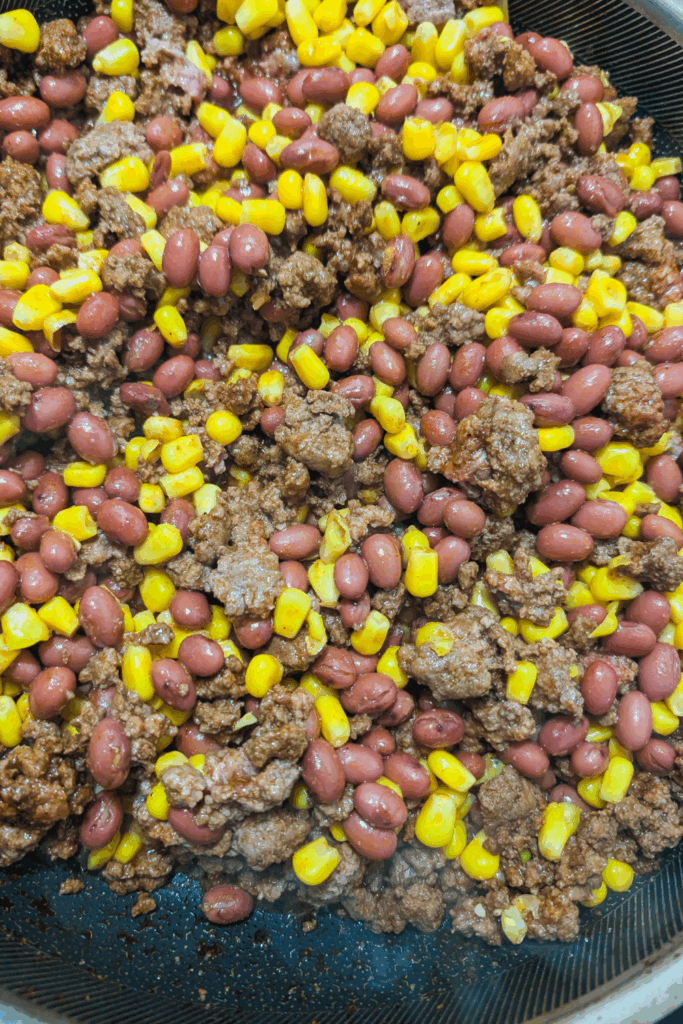mixing chili before adding sauce