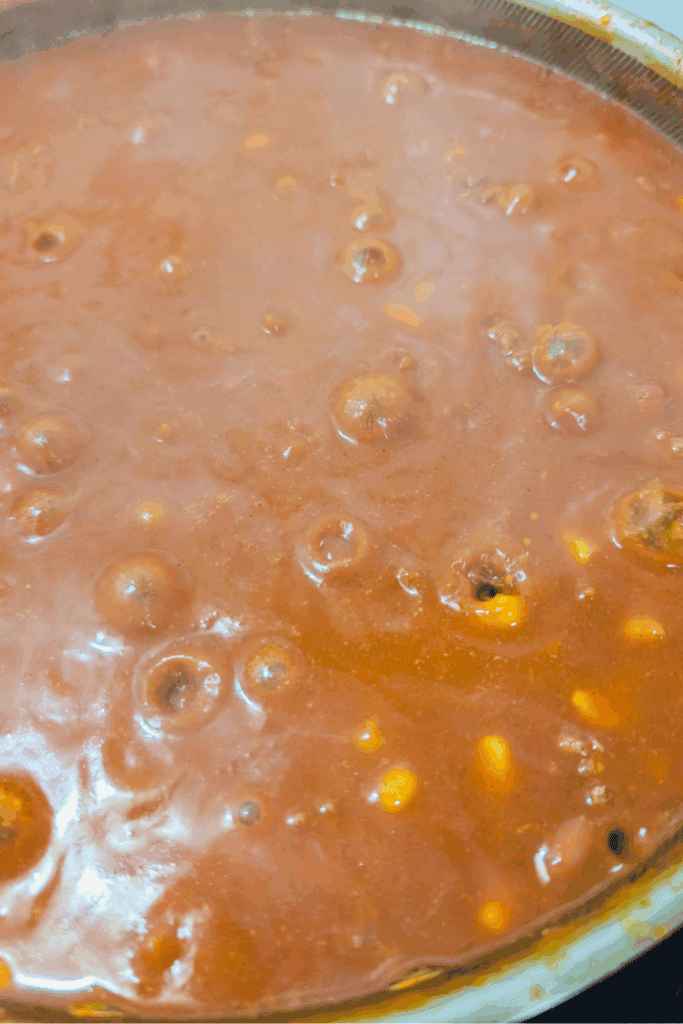 simmering chili on stove