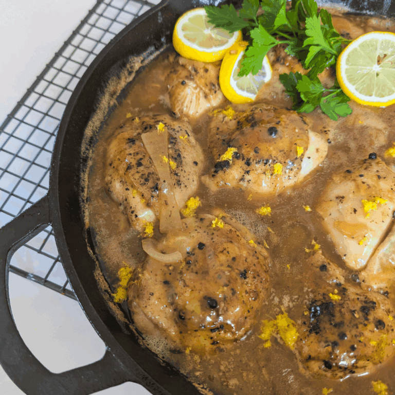 Juicy braised chicken thighs with lemon and fresh herbs in a savory sauce. Perfect for easy, flavorful weeknight dinners.