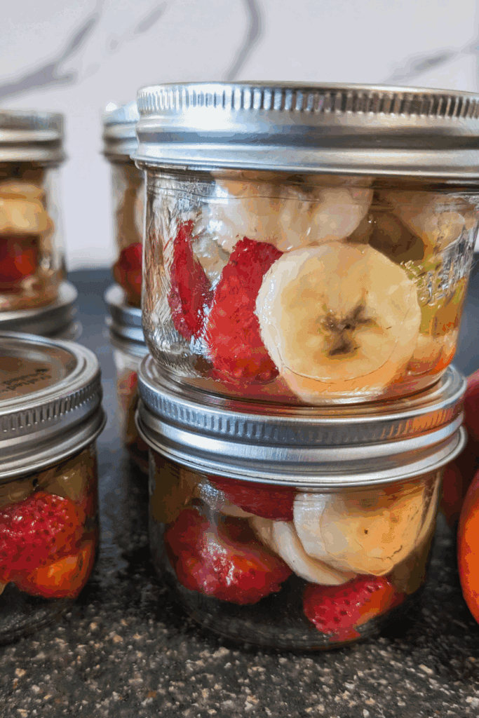 Fresh mixed fruit preserves in glass jars, perfect for DIY canning and healthy snack options.