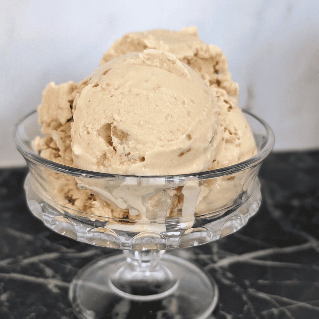 Creamy maple sugar ice cream served in a glass dish.