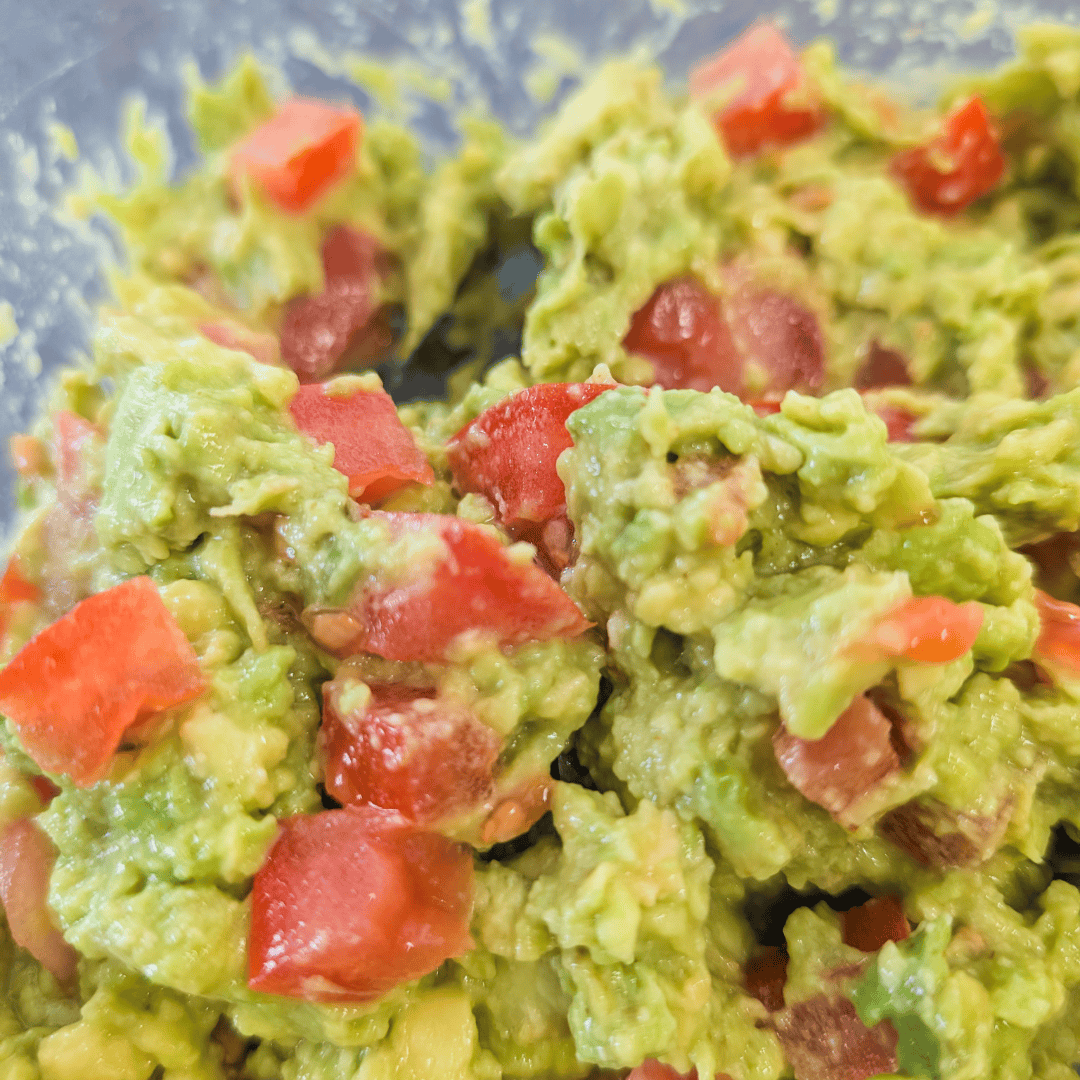 Fresh homemade guacamole with tomatoes, no lime juice, easy recipe.