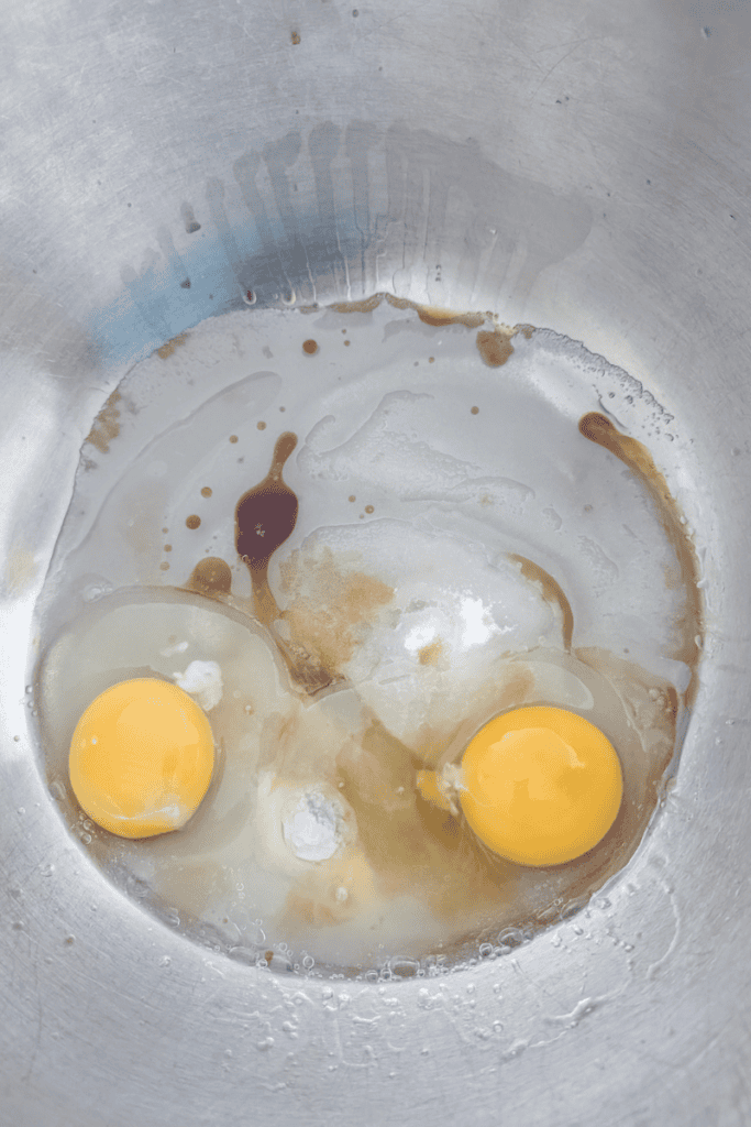 Eggs for blueberry muffin batter with frozen Canadian wild blueberries.