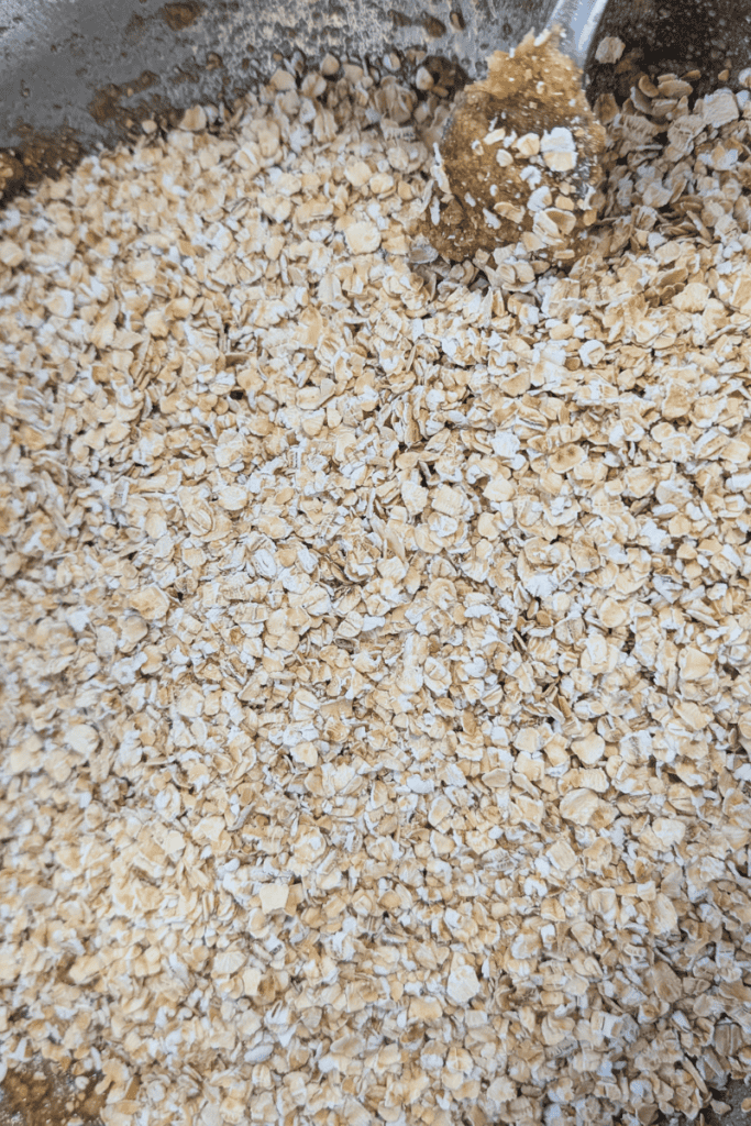 Delicious chewy oatmeal cookie dough mixed with black sesame seeds, ready for baking or snacking.