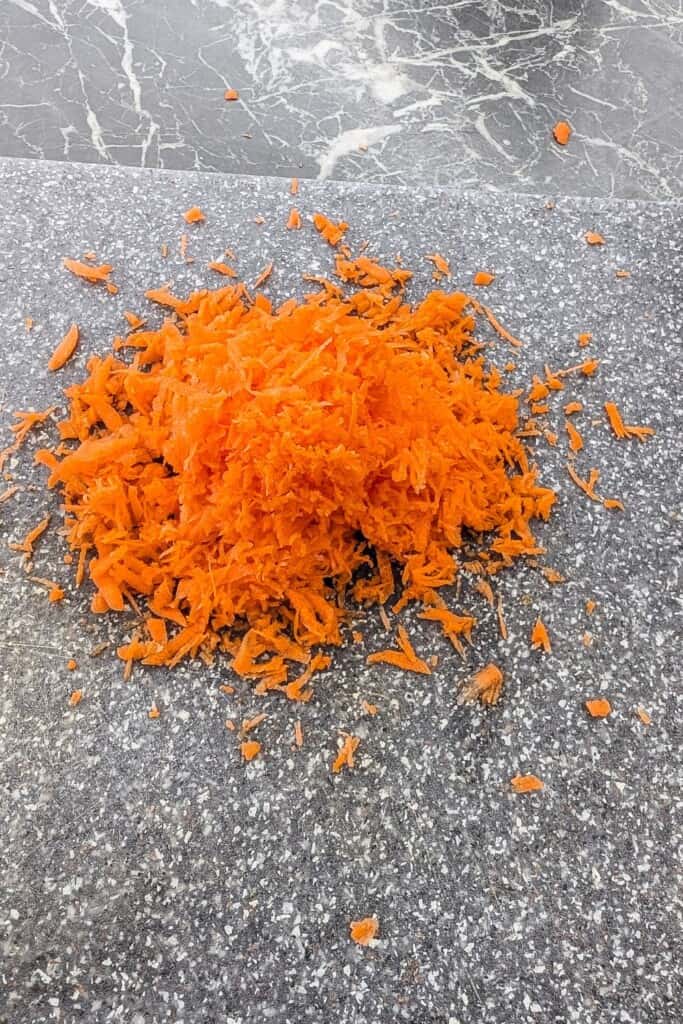 Freshly grated carrot for carrot oatmeal muffins.