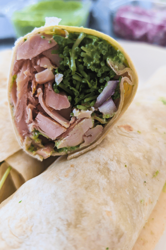 Healthy chicken wrap with fresh greens and leftover chicken. Perfect for quick, nutritious lunches.